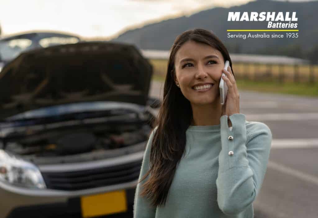 woman calling battery replacement service for flat battery