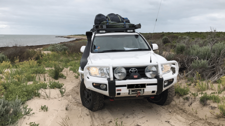 SUV vehicle parked at beach