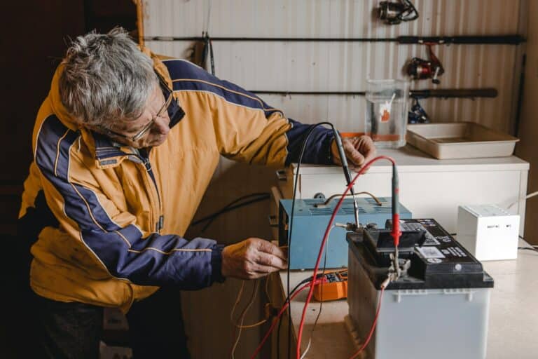 Mechanic doing service on electric car battery